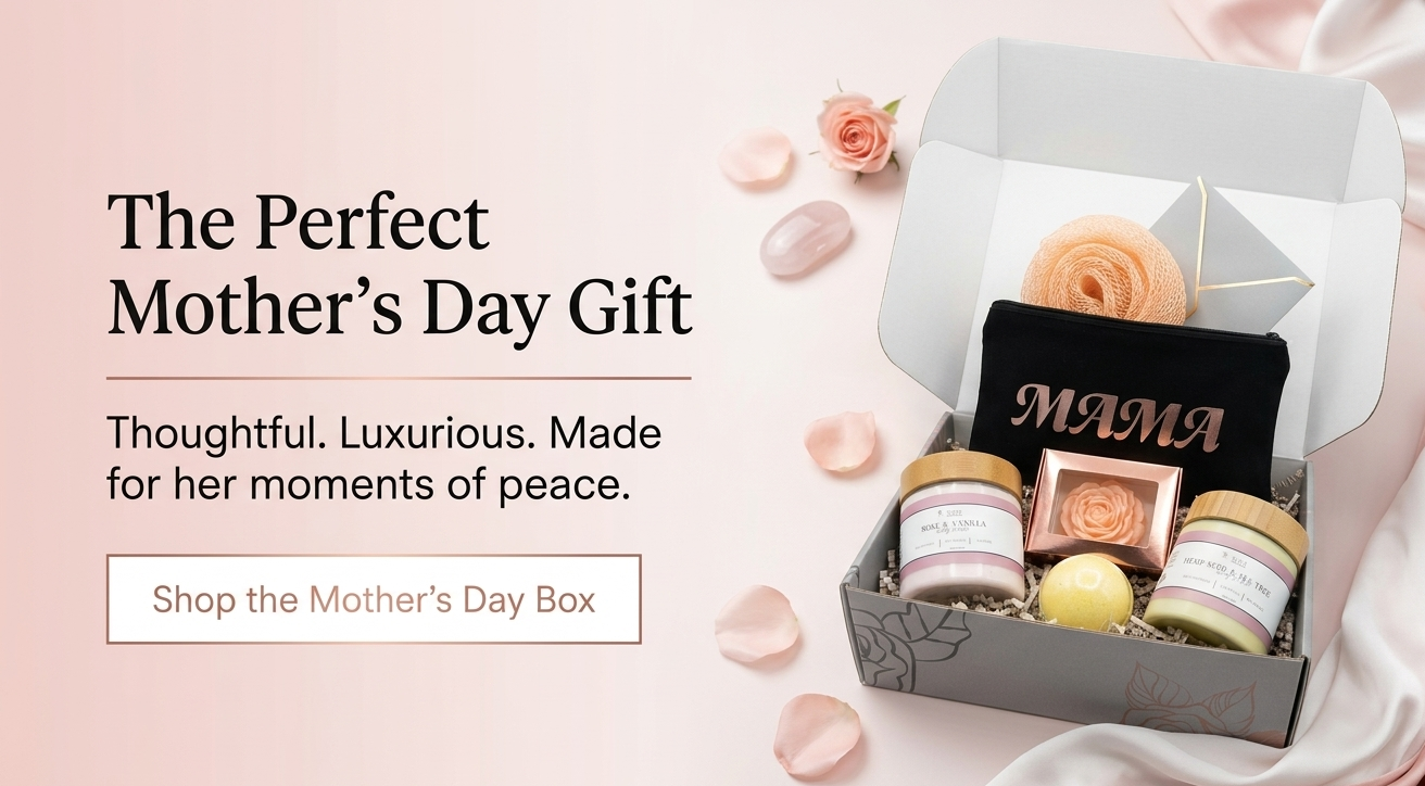 Mother's Day gift box with candles, a small plant, and a 'MAMA' sign on a soft pink background.
